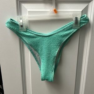 Bright teal bottoms. Never worn